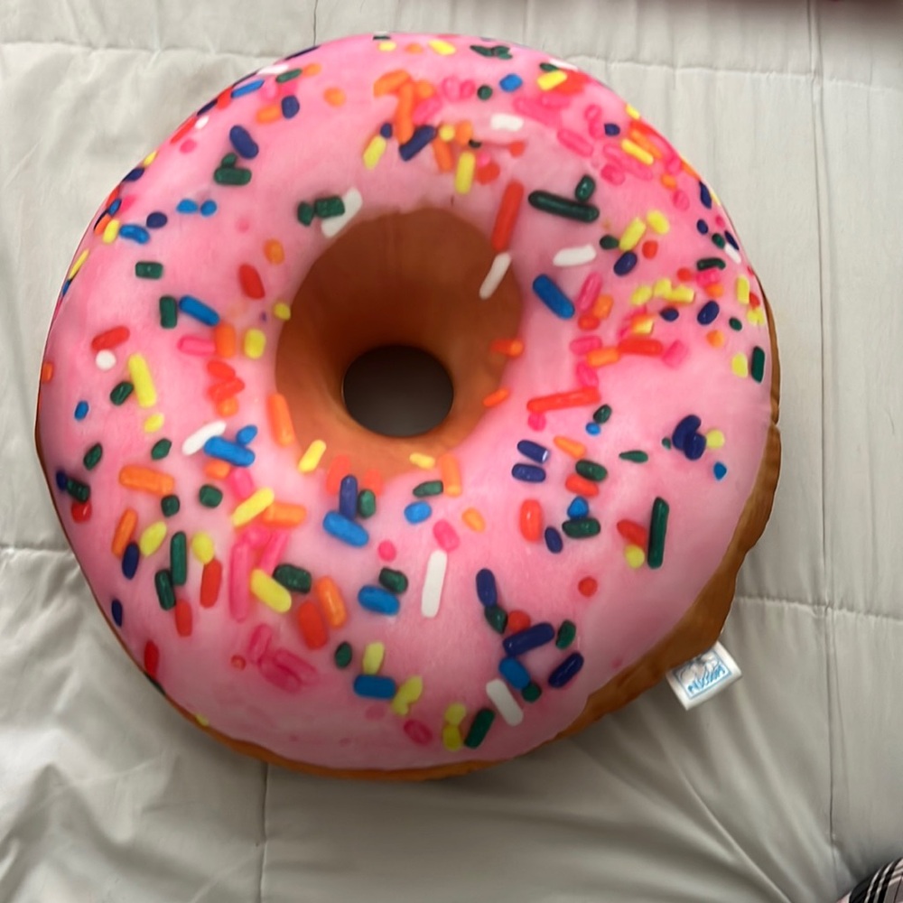 Double pink and brown sided donut scented decor pillow. From Target